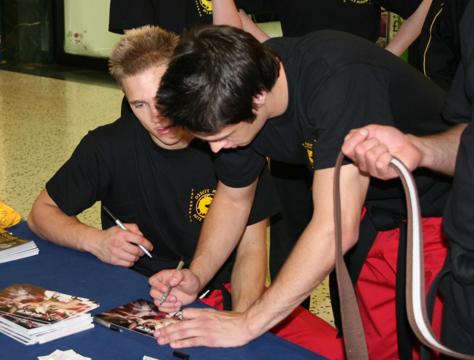 Danny Ball and Liam Richards signing autographs